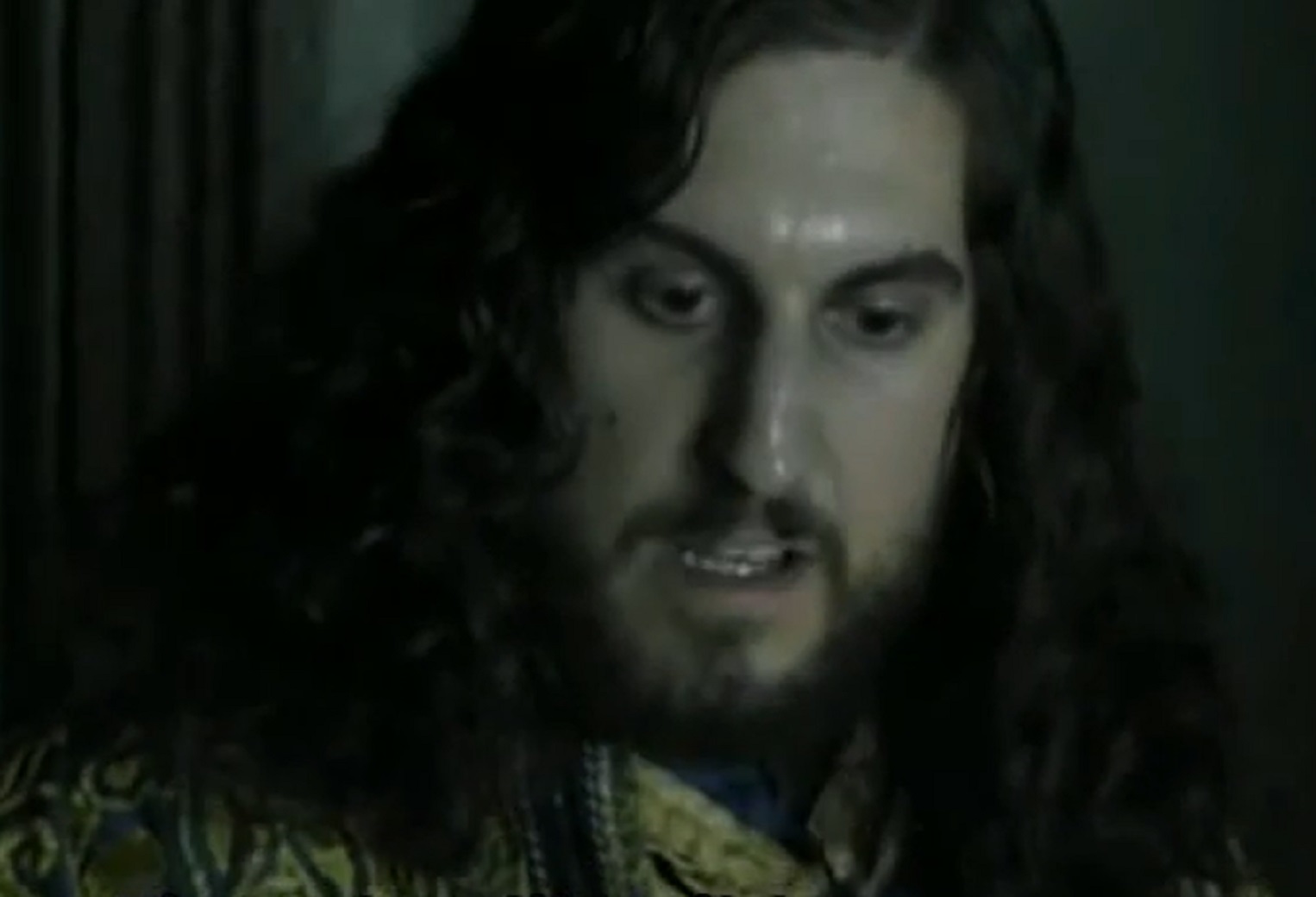 Screenshot of Charles VIII of France with long hair looking down - from Isabel (2011-2014)