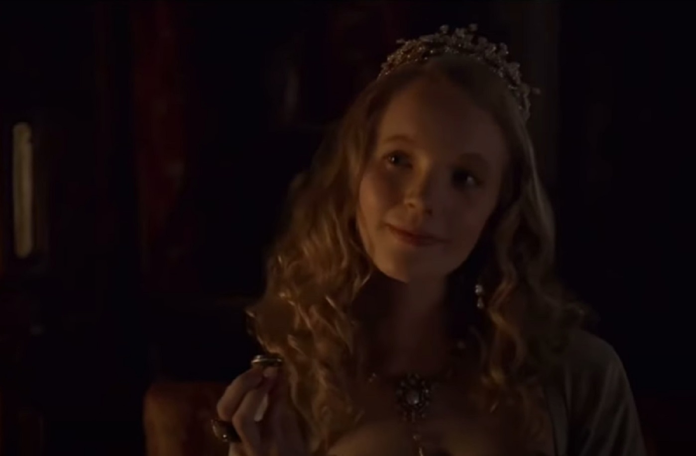 Screenshot of Catherine Howard with long hair looking and smiling - from The Tudors (2007–2010)