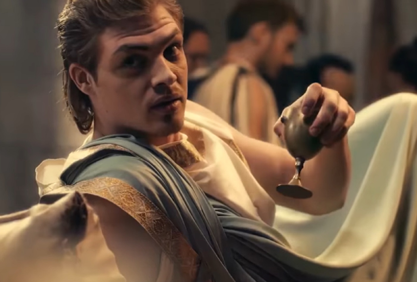 Screenshot of Alexander The Great holding a cup and looking at side - from Alexander the Great (2014)