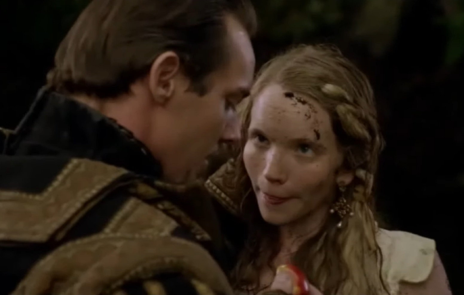 Screenshot of Catherine Howard with long hair is looking and talking with Henry VIII - from The Tudors (2007–2010)