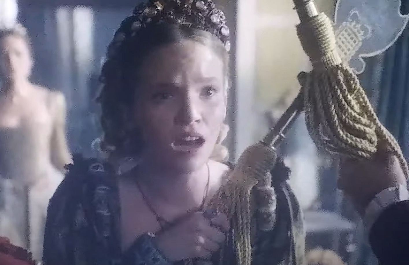 Screenshot of Catherine Howard with long hair standing with guards looking afraid - from The Tudors (2007–2010)