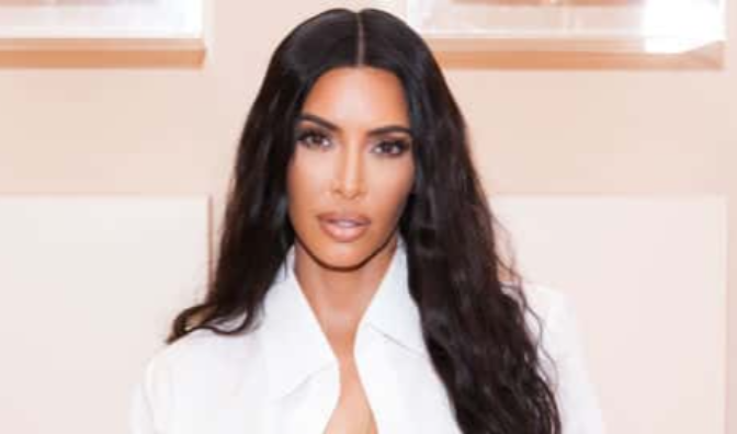 Kim Kardashian West at her first-ever KKW Beauty and Fragrance pop-up opening at Westfield Century City in Los Angeles, wearing white dress