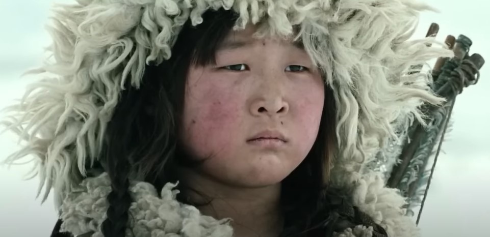 Genghis Khan as a boy as depicted in the movie outside while snowing