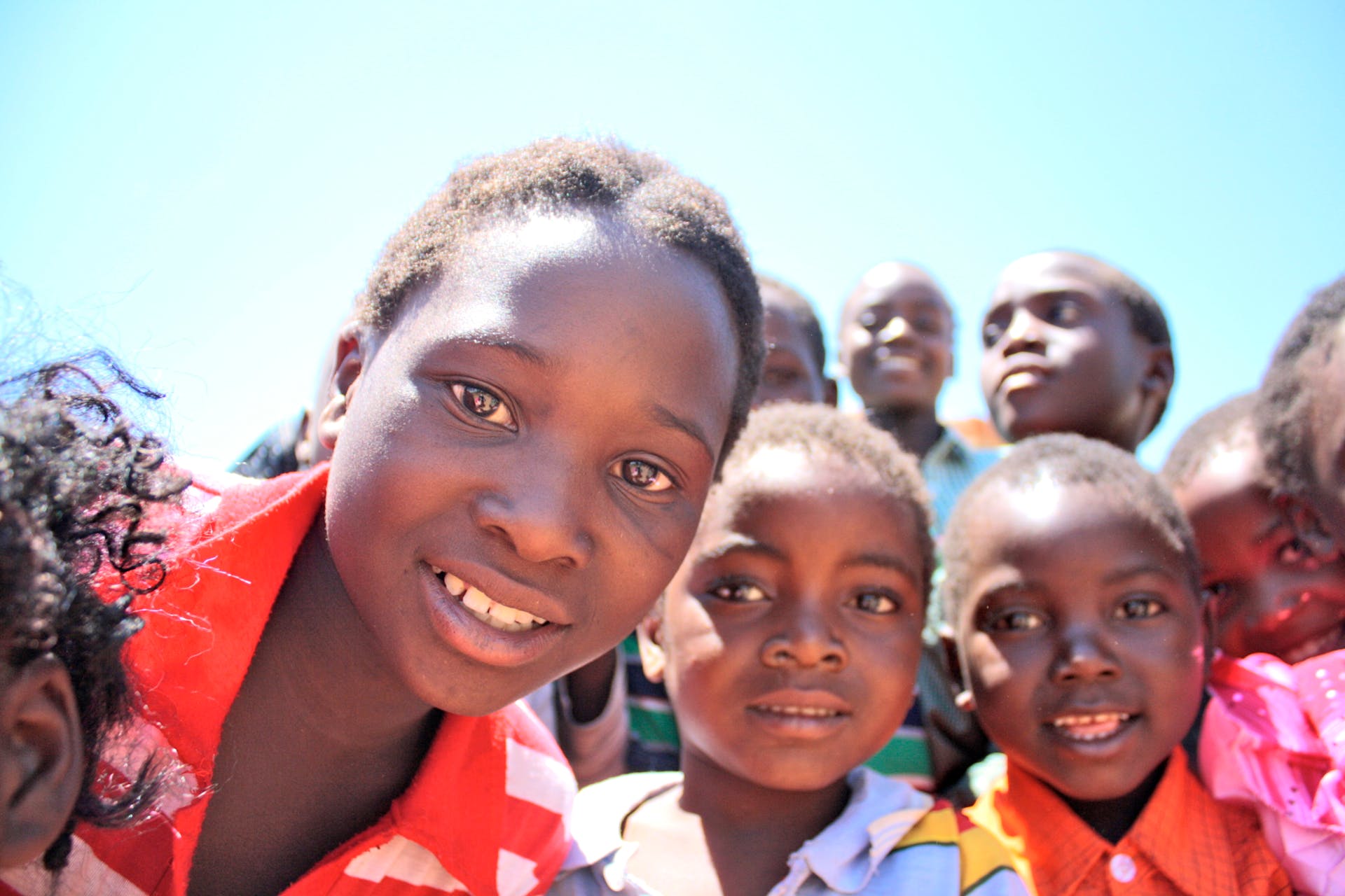 group photo of children smiling and facing the camera
