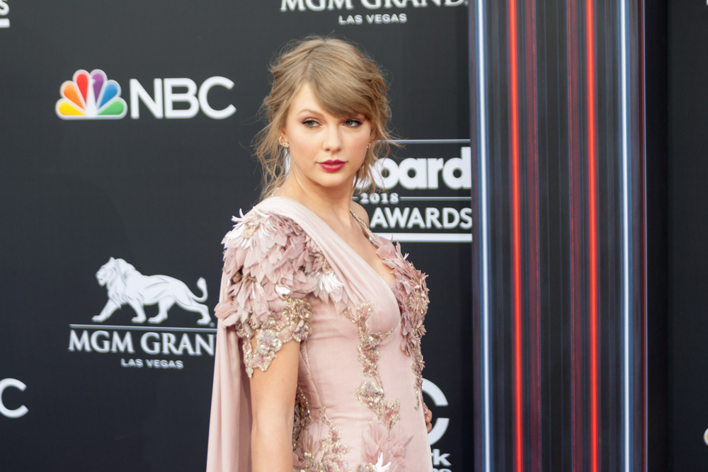 Taylor Swift attends the Red Carpet at the Billboards Music Awards at the MGM Grand Arena in Las Vegas, Nevada, wearing pink floral dress