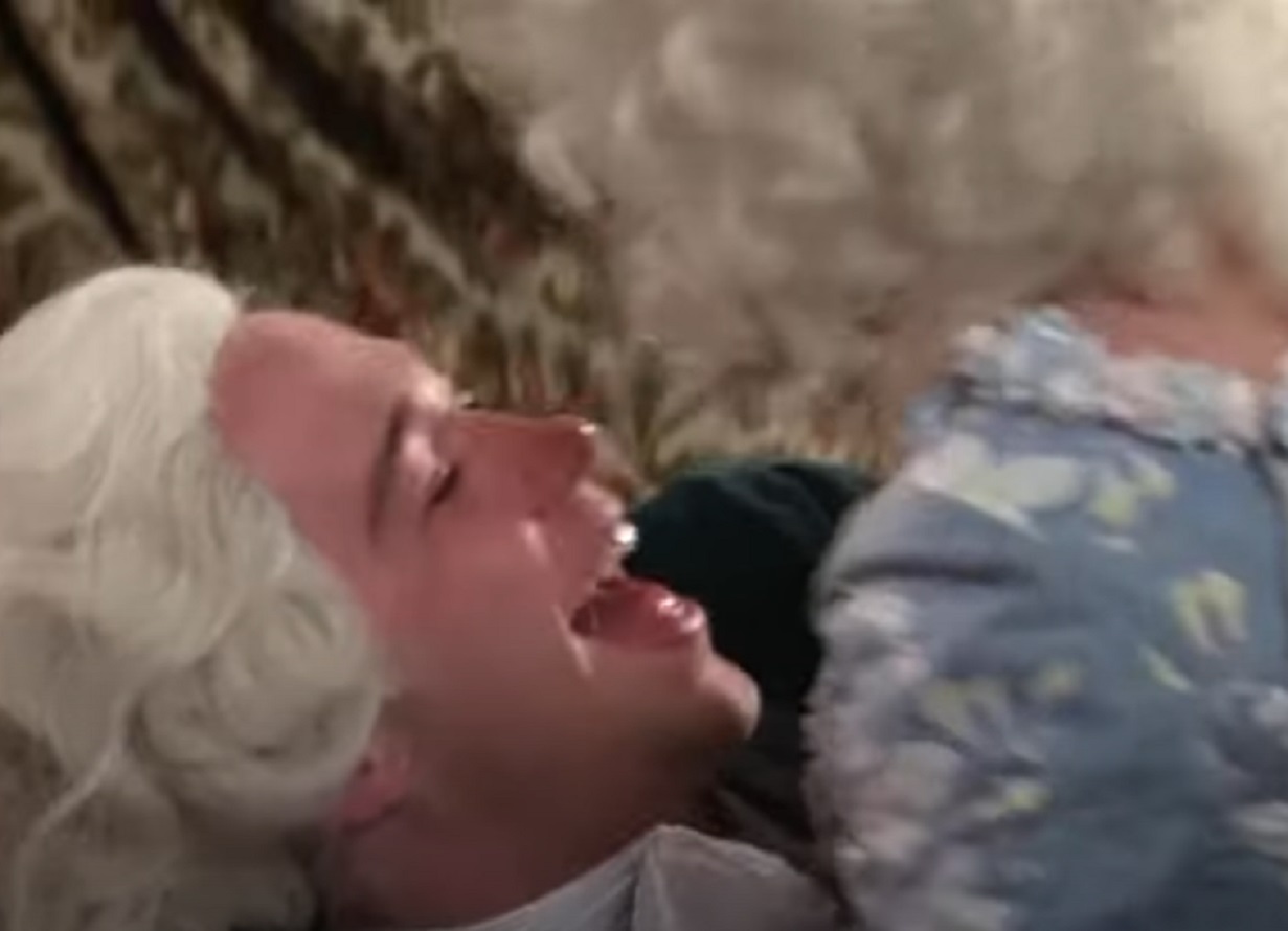 Screenshot: Wolfgang Amadeus Mozart is smiling with other female - from Amadeus (1984)