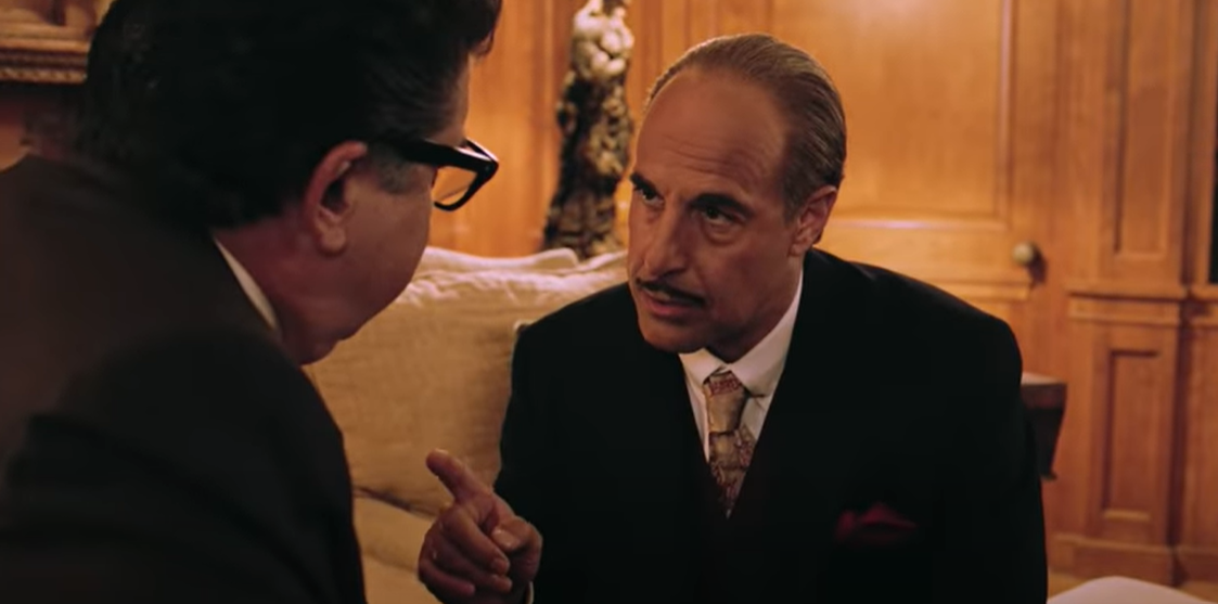Stanley Tucci as Jack L. Warner in suit