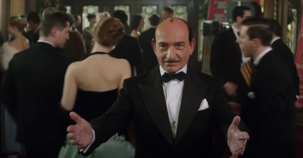 Ben Kingsley as  Jack L Warner in suit