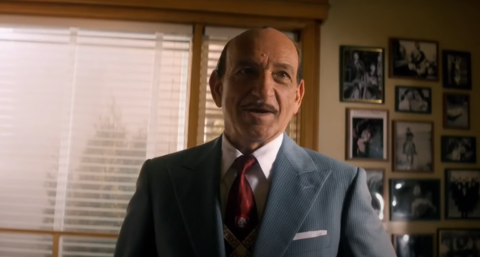 Ben Kingsley as  Jack L Warner in suit