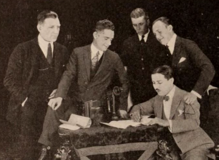 Sam Warner, director Frank Griffin, Howard Hawks, and Jack Warner,