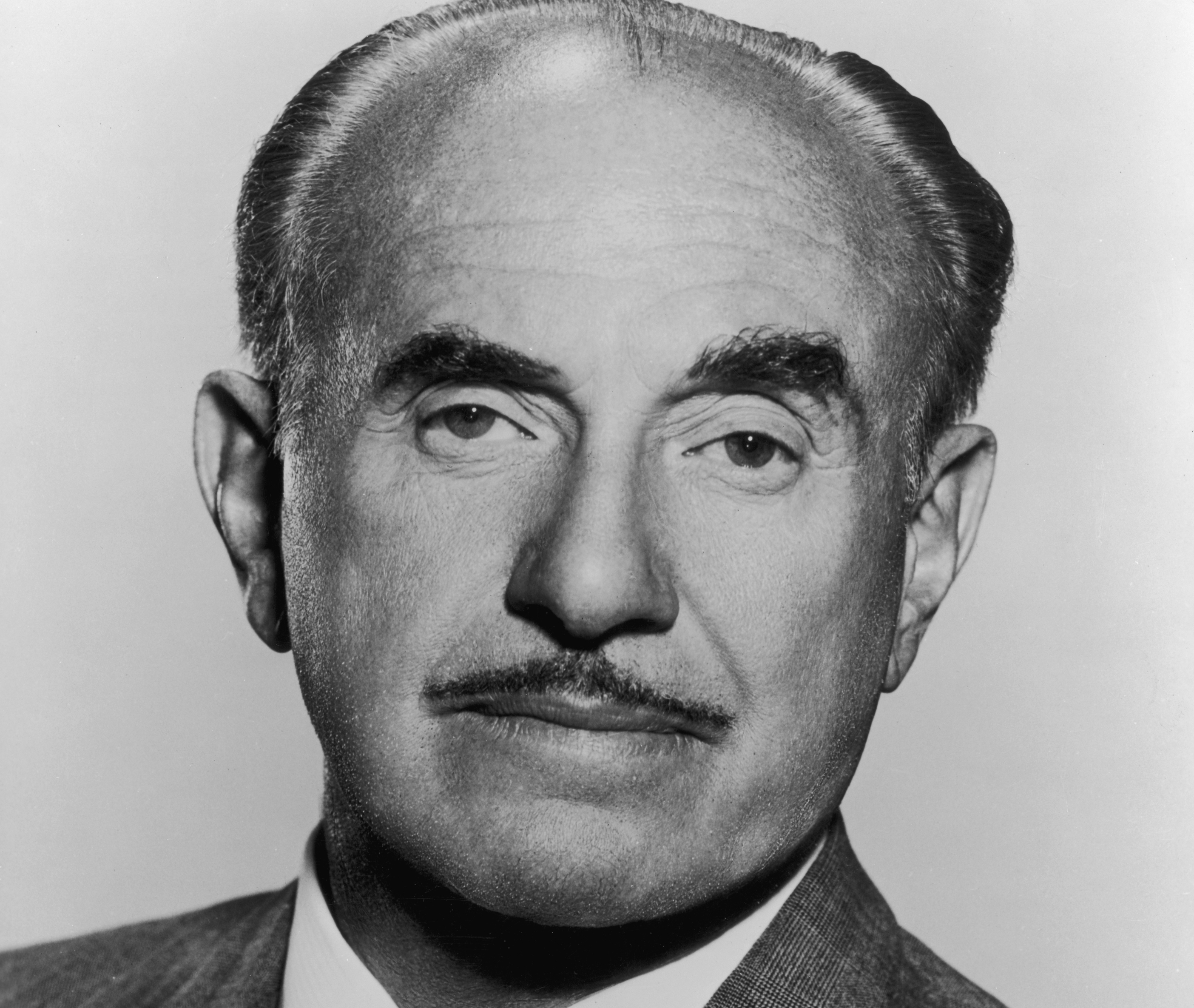 Headshot portrait of American film executive Jack L. Warner
