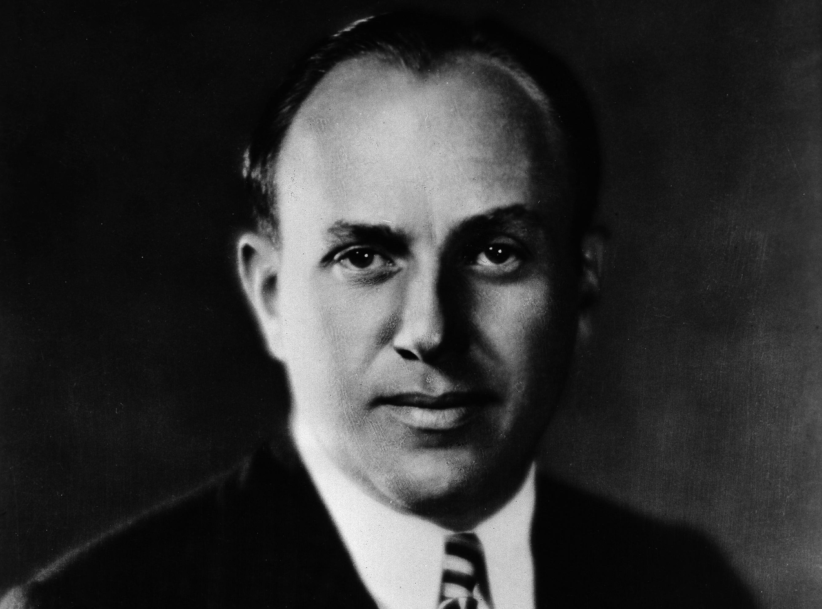 Jack L. Warner in suit