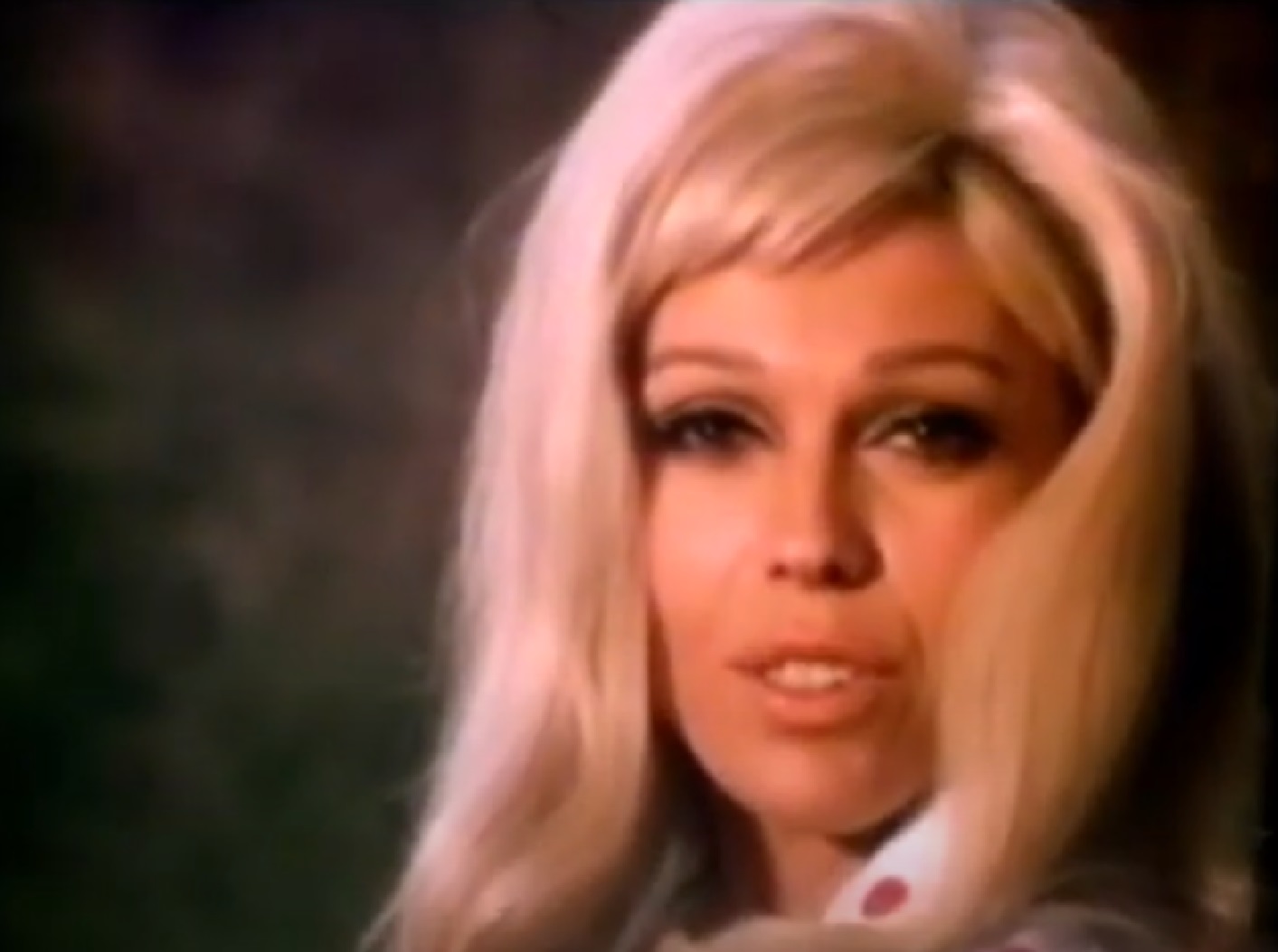 Screenshot of Nancy Sinatra looking at camera - from Movin  With Nancy (1967)