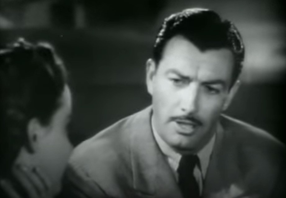 Robert Taylor  in Song of Russia speaking to a woman