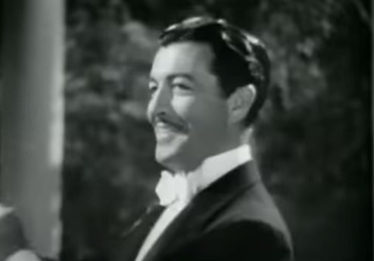 Robert Taylor  in Song of Russia conducting an orchestra