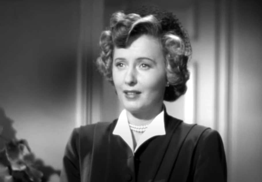 East Side, West Side Barbara Stanwyck wearing pearls and a suit