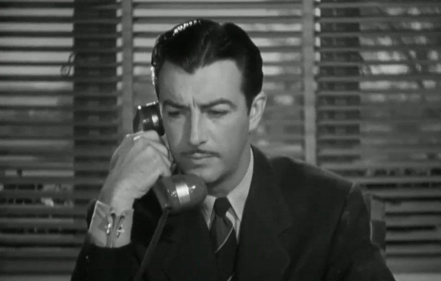 Robert Taylor in Johnny Eager (1941) wearing a  suit