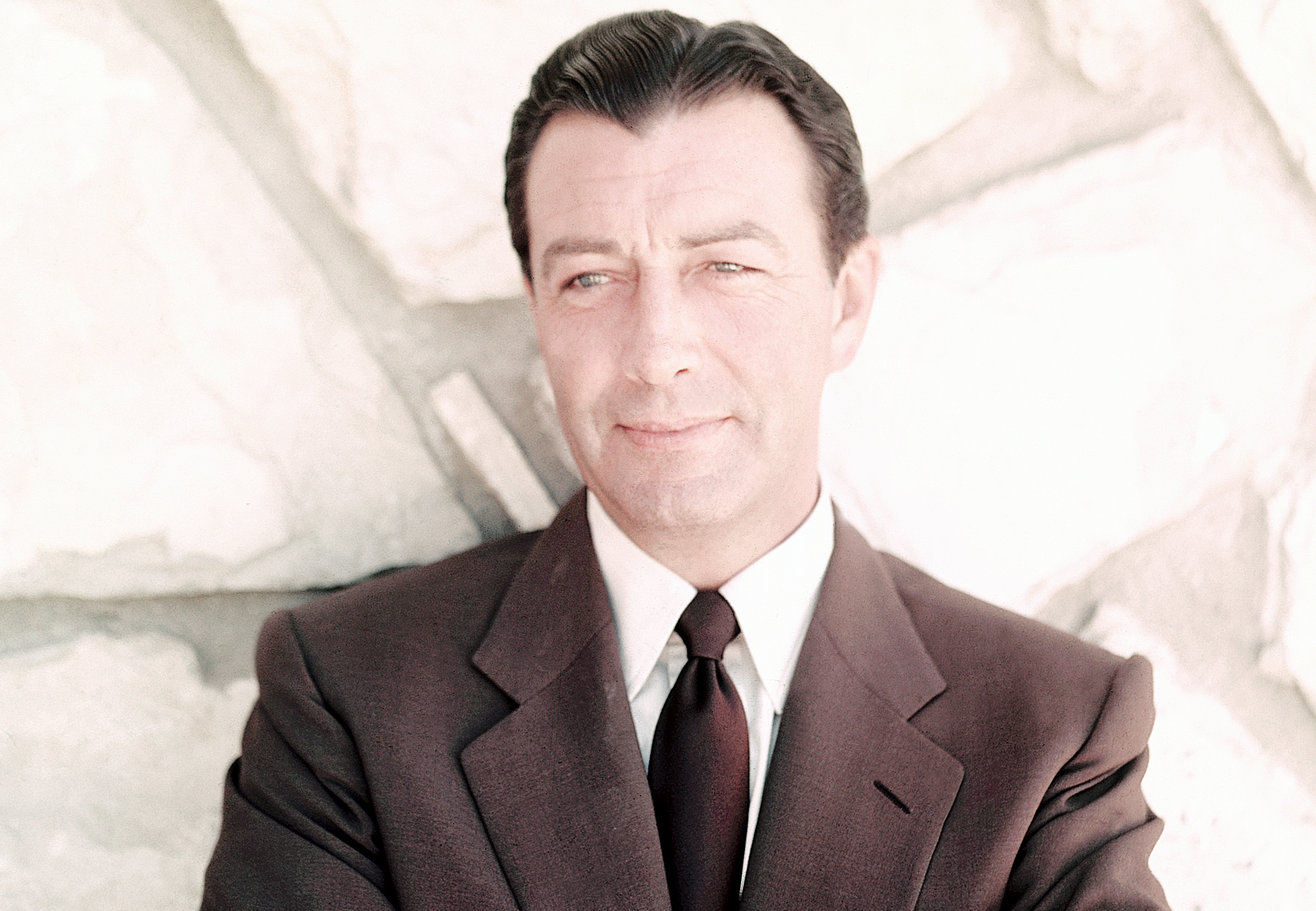 American actor Robert Taylor (1911 - 1969), circa 1955 in brown suit