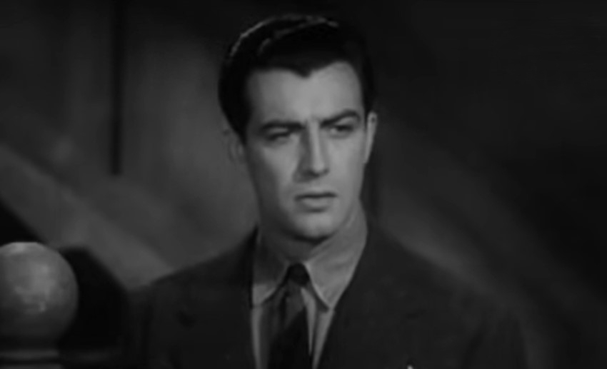 Robert Taylor as Lee Sheridan in A Yank at Oxford wearing a suit
