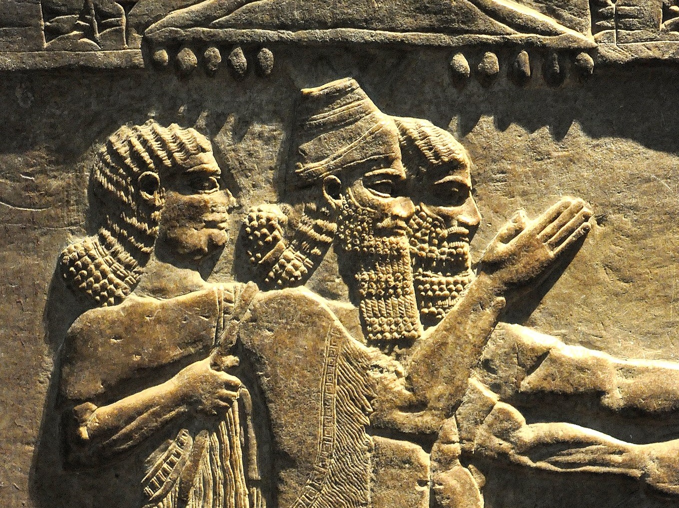 The Assyrian king, identified by his conical cap with a turban - circa 730-727 BCE.