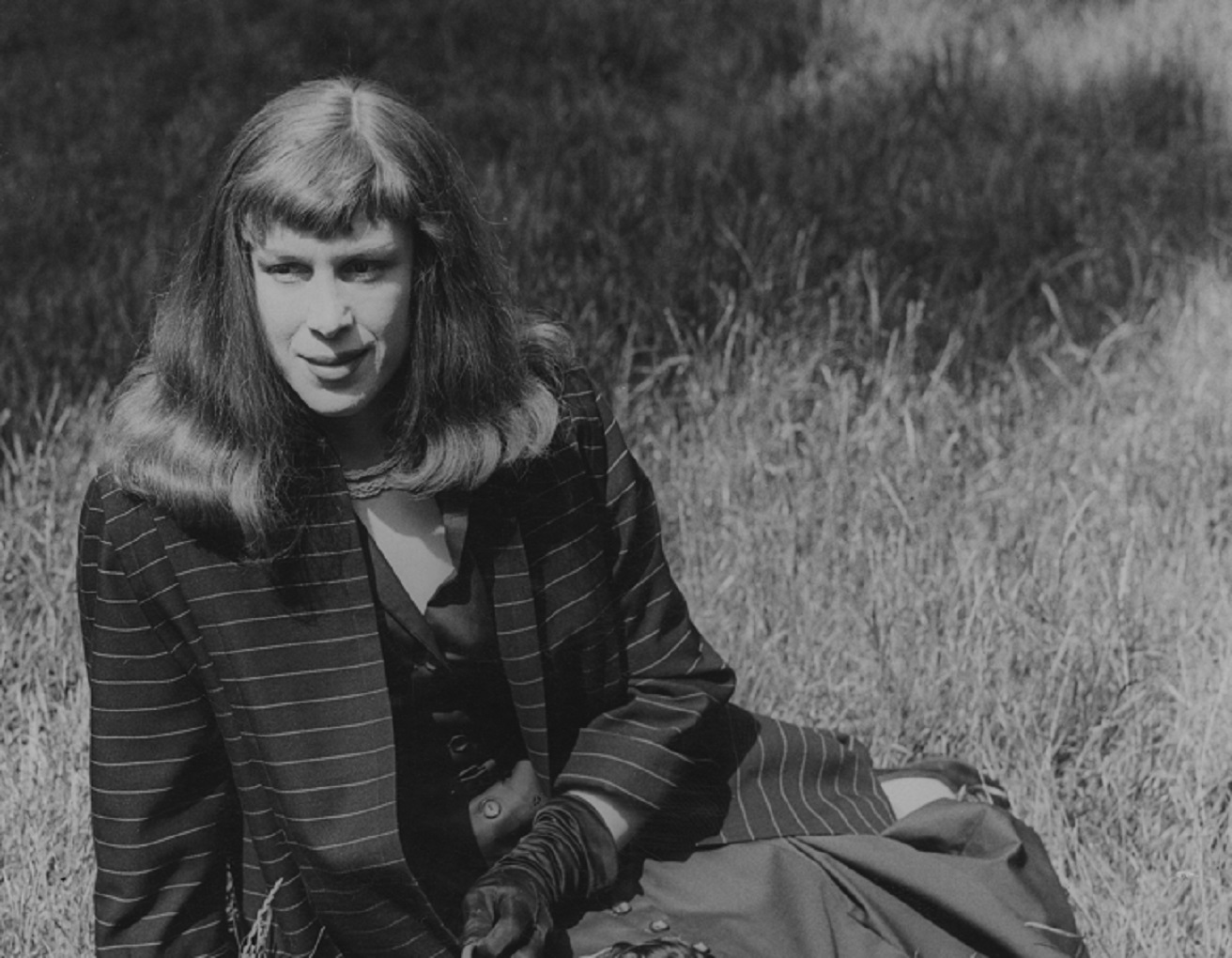Former wartime fighter pilot Roberta Cowell (1918 - 2011) with her dogs in Kensington Gardens, London, 21st June 1954