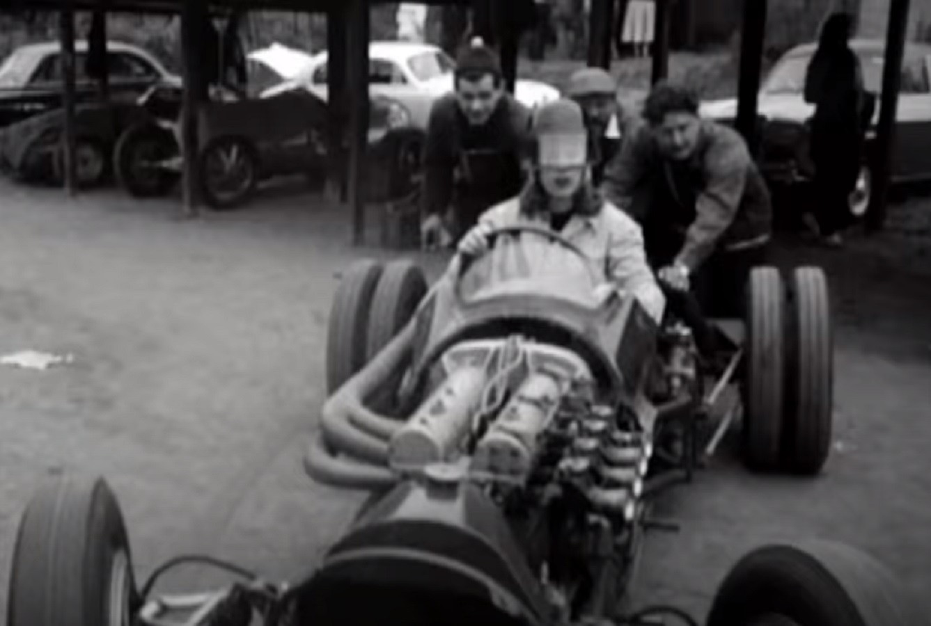 Screenshot: Roberta Cowell wearing helmet is driving a racing car - from Secret History - The Sex Change Spitfire Ace (2015)