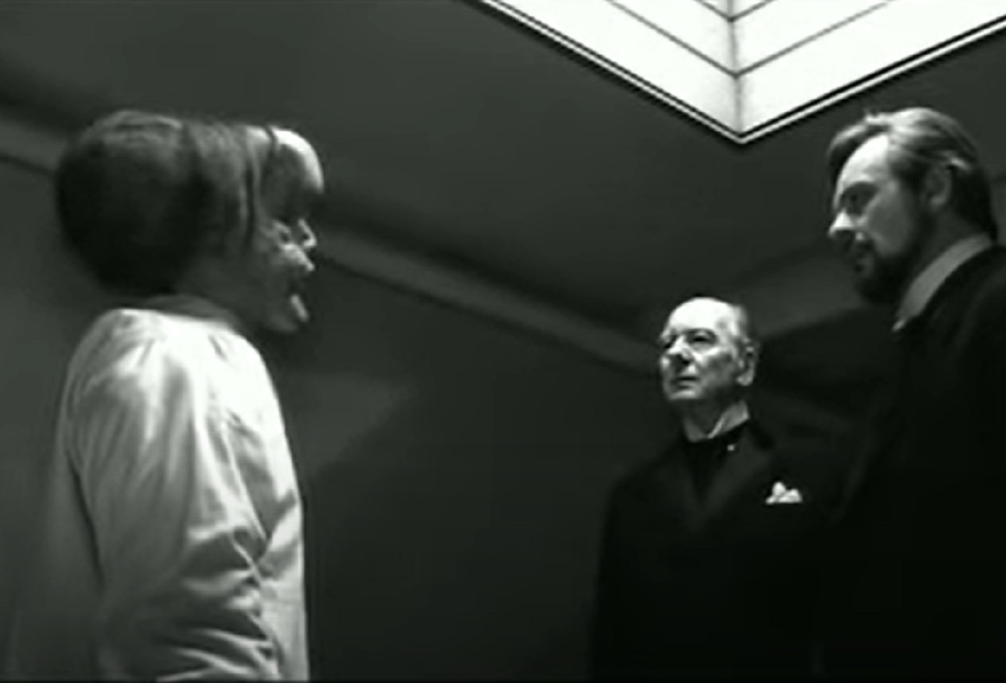 B&W Screenshot of Joseph Merrick (John Hurt) in company with police officer and Dr . Treves - from Elephant Man (1980)