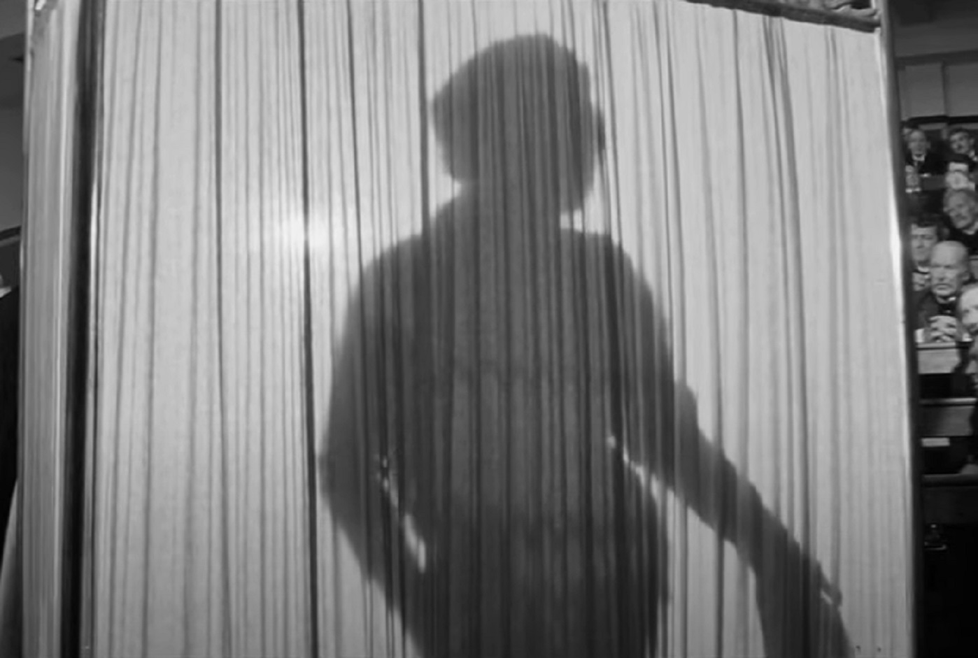 B&W Screenshot of man presenting the Elephant Man in the hospital - from Elephant Man (1980)