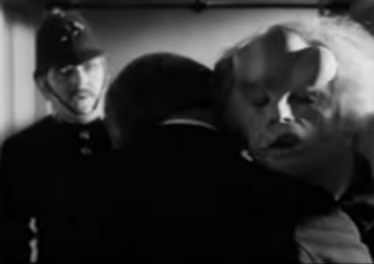 B&W Screenshot of Joseph Merrick (John Hurt) in company with police officer and Dr . Treves - from Elephant Man (1980)