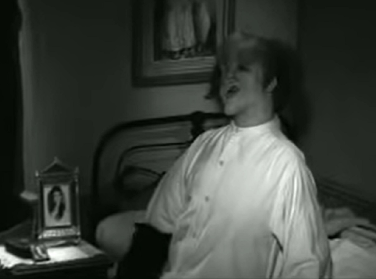 B&W Screenshot of Joseph Merrick (John Hurt) seating on the bed - from Elephant Man (1980)
