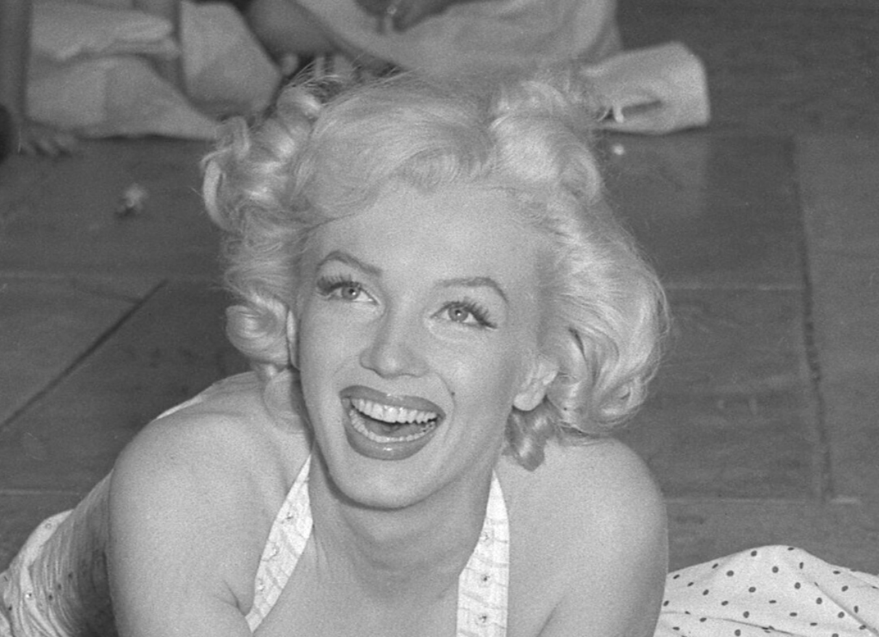 Marilyn Monroe putting handprints in wet concrete at Chinese Theater in Los Angeles - 1953