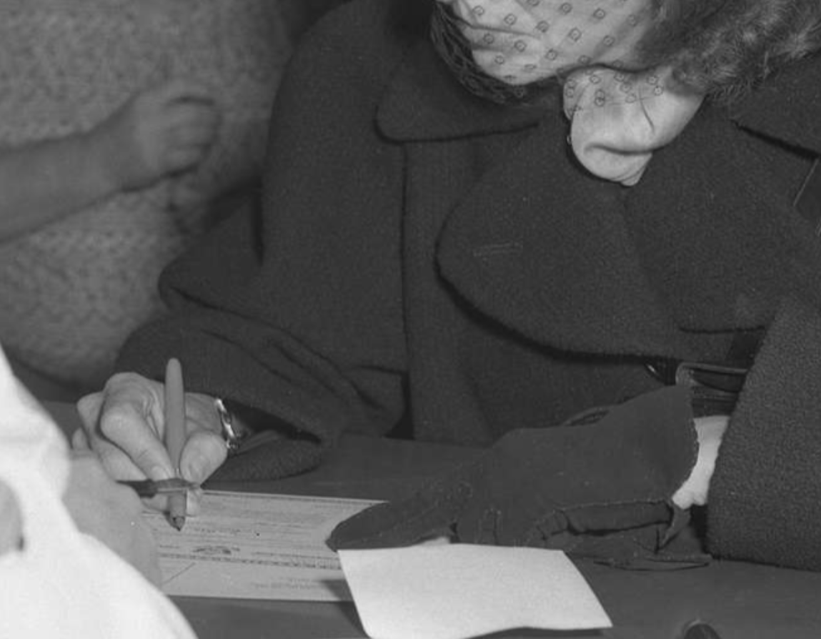 Actress Greta Garbo filling out paperwork for United States citizenship - 1950