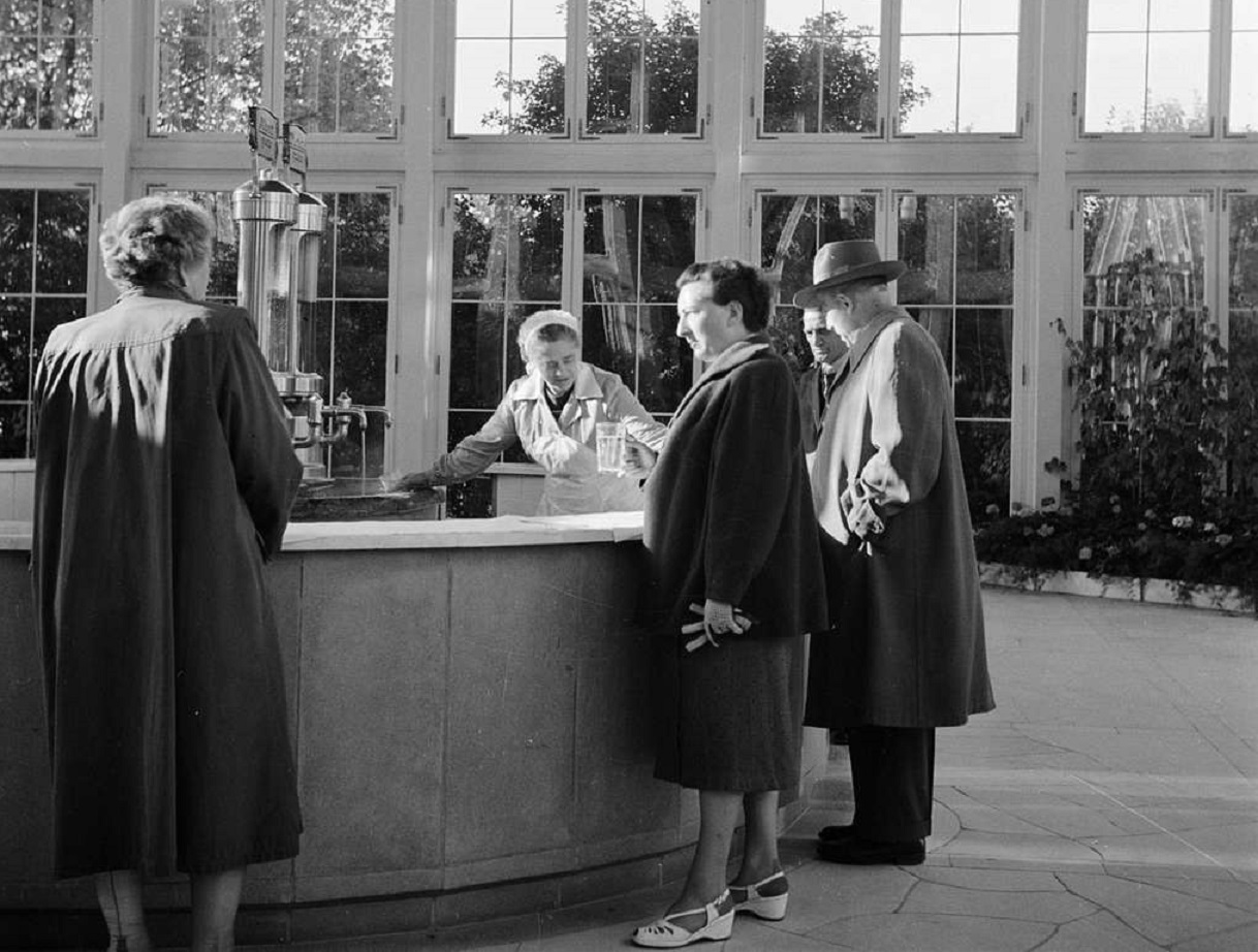 People are having a drink in lobby - 1953
