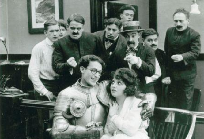 Actor Harold Lloyd and Actress Bebe Daniels in the movie Ask Father sitting next to each other