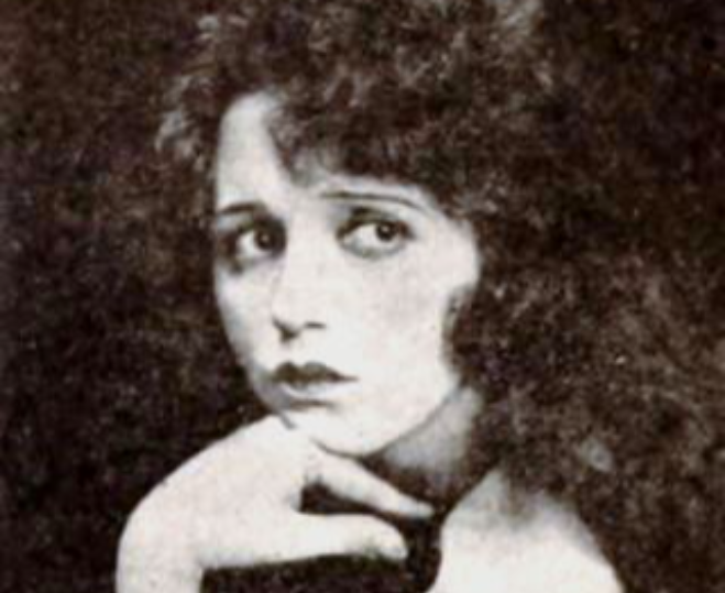 Grayscal Photo of the Actress Bebe Daniels leaning her head on her arm