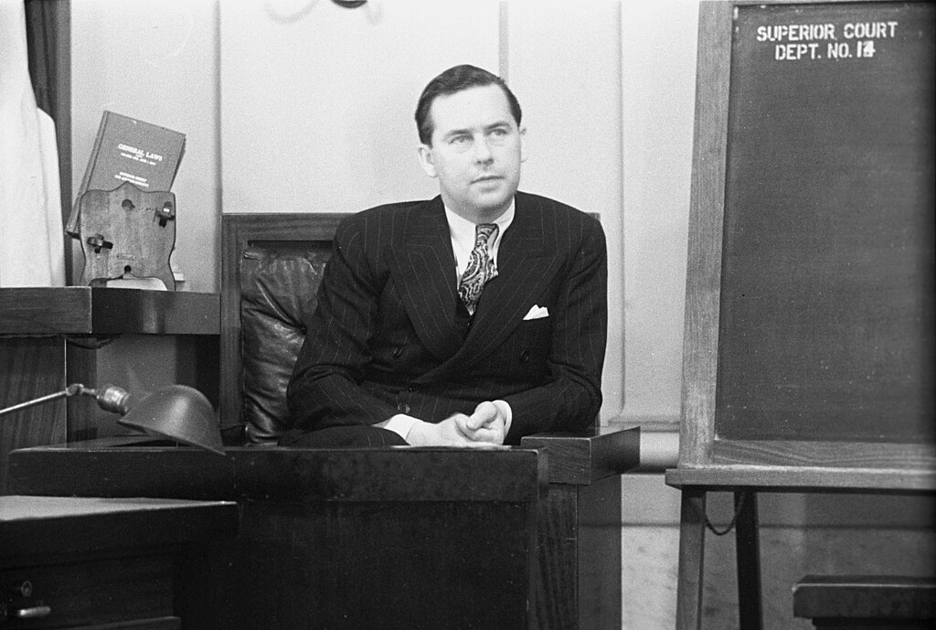 Actor Ben Lyon on the witness stand during a trial for war veteran Albert F. Holland.