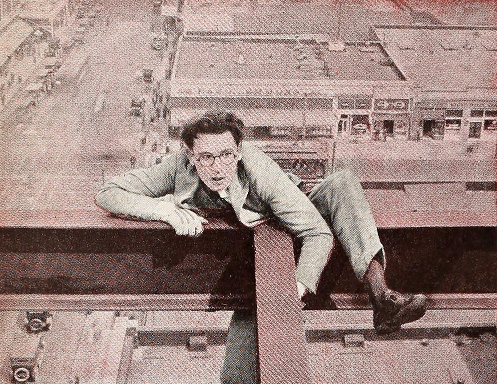 The Actor Comedian Harold Lloyd in the movie Never Weaken, clinging on roof top