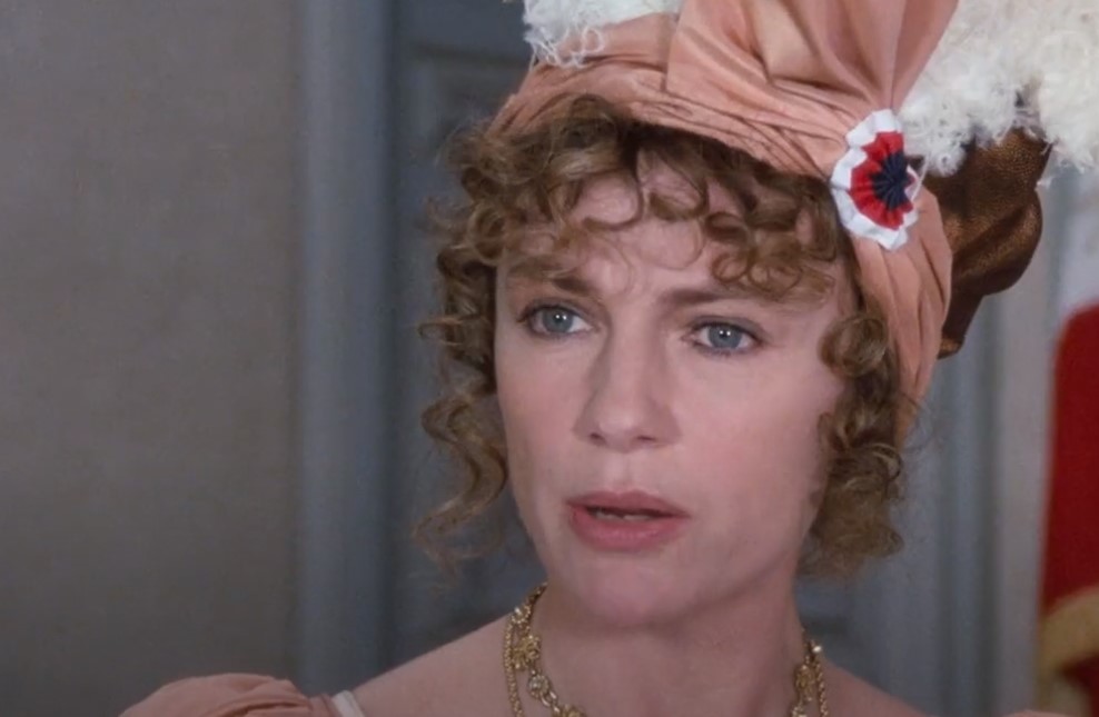 Empress Josephine in orange dress and a hat 