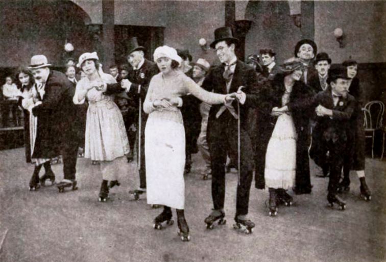 Still from the American comedy short film Don't Shove (1919) with Harold Lloyd, Bebe Daniels and other actors