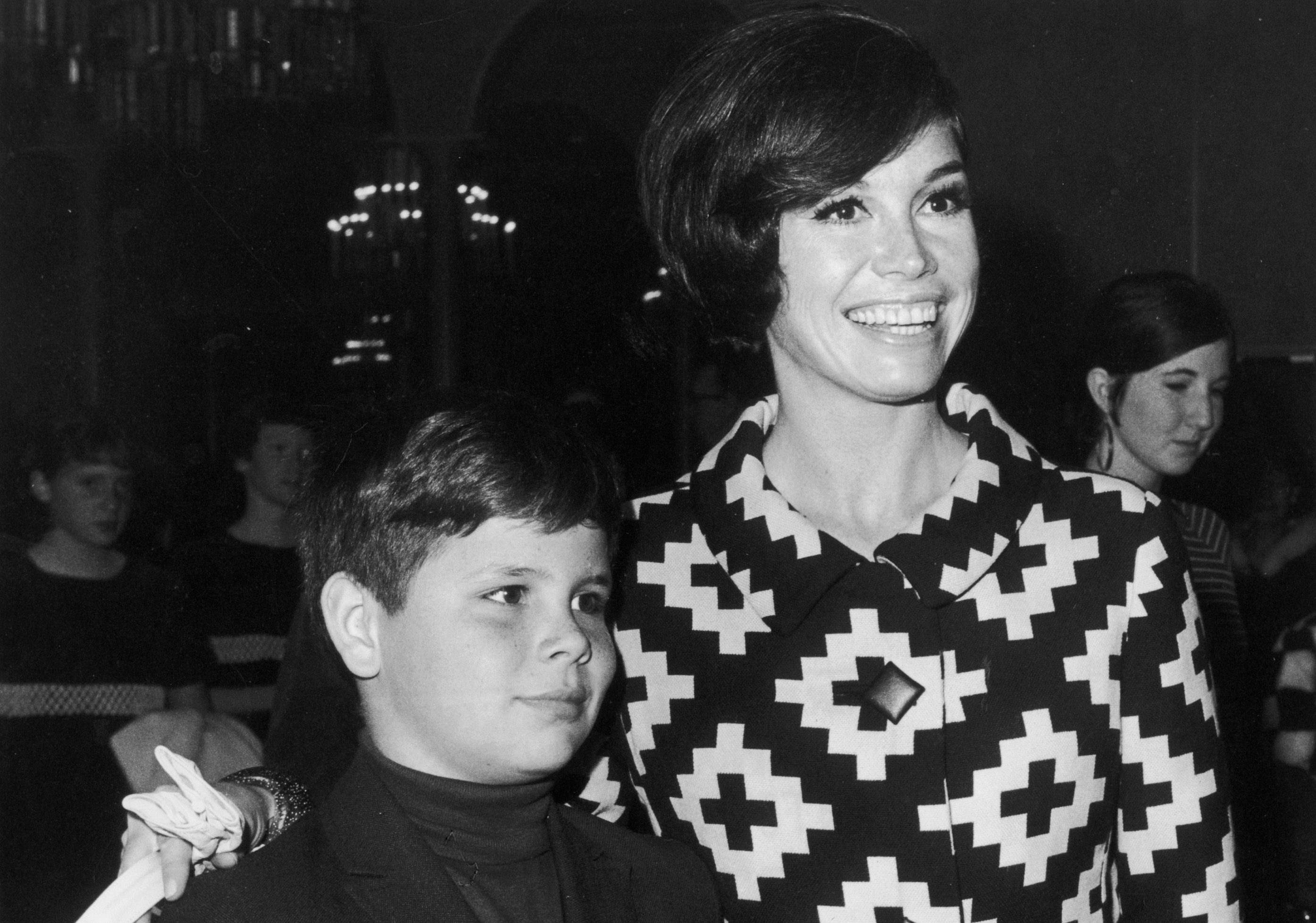 American actor Mary Tyler Moore puts her arm around her son, Richard Meeker Jr