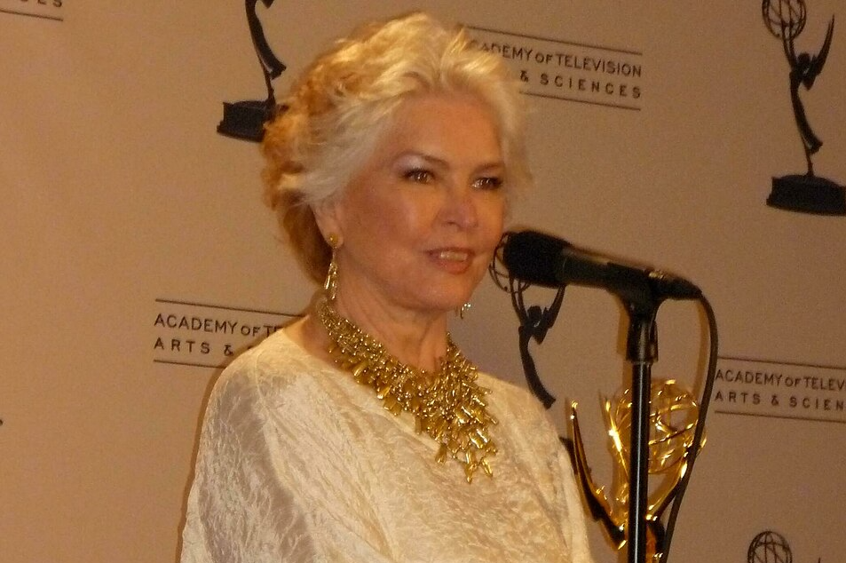 Portrait Photo of the American Actress Ellen Burstyn at the Creative Arts Emmy Awards wearing light colored outfit and golden necklace
