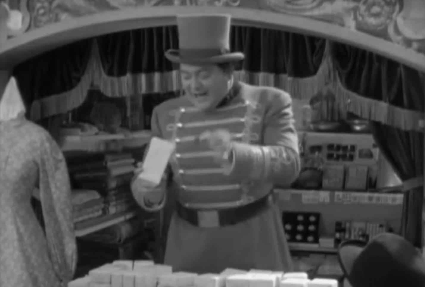 Screenshot of James Fisk (Edward Arnold) wearing uniform and talking talking at people- from The Toast of New York (1937)