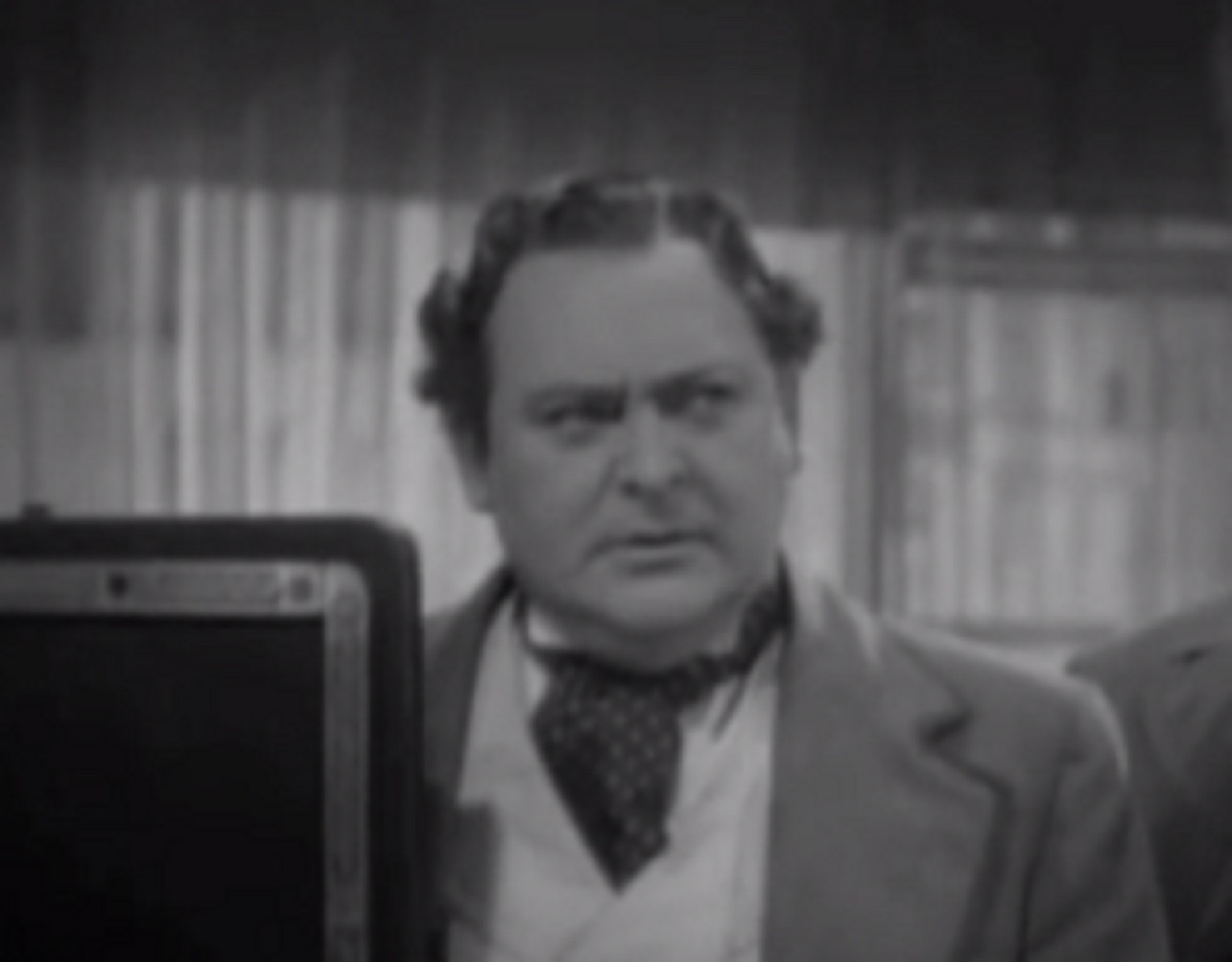 Screenshot of James Fisk (Edward Arnold) looking upset at side - from The Toast of New York (1937)
