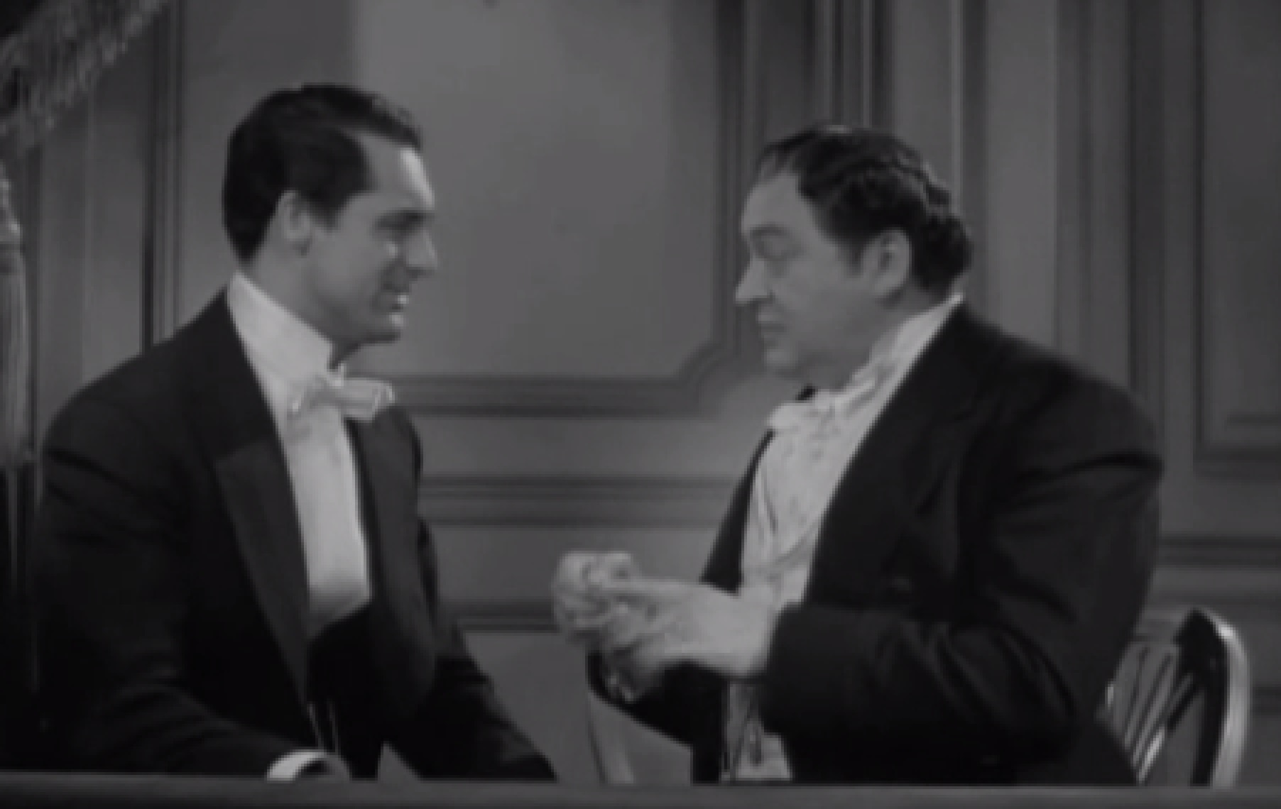 Screenshot of James Fisk (Edward Arnold) wearing suit is talking with other man - from The Toast of New York (1937)