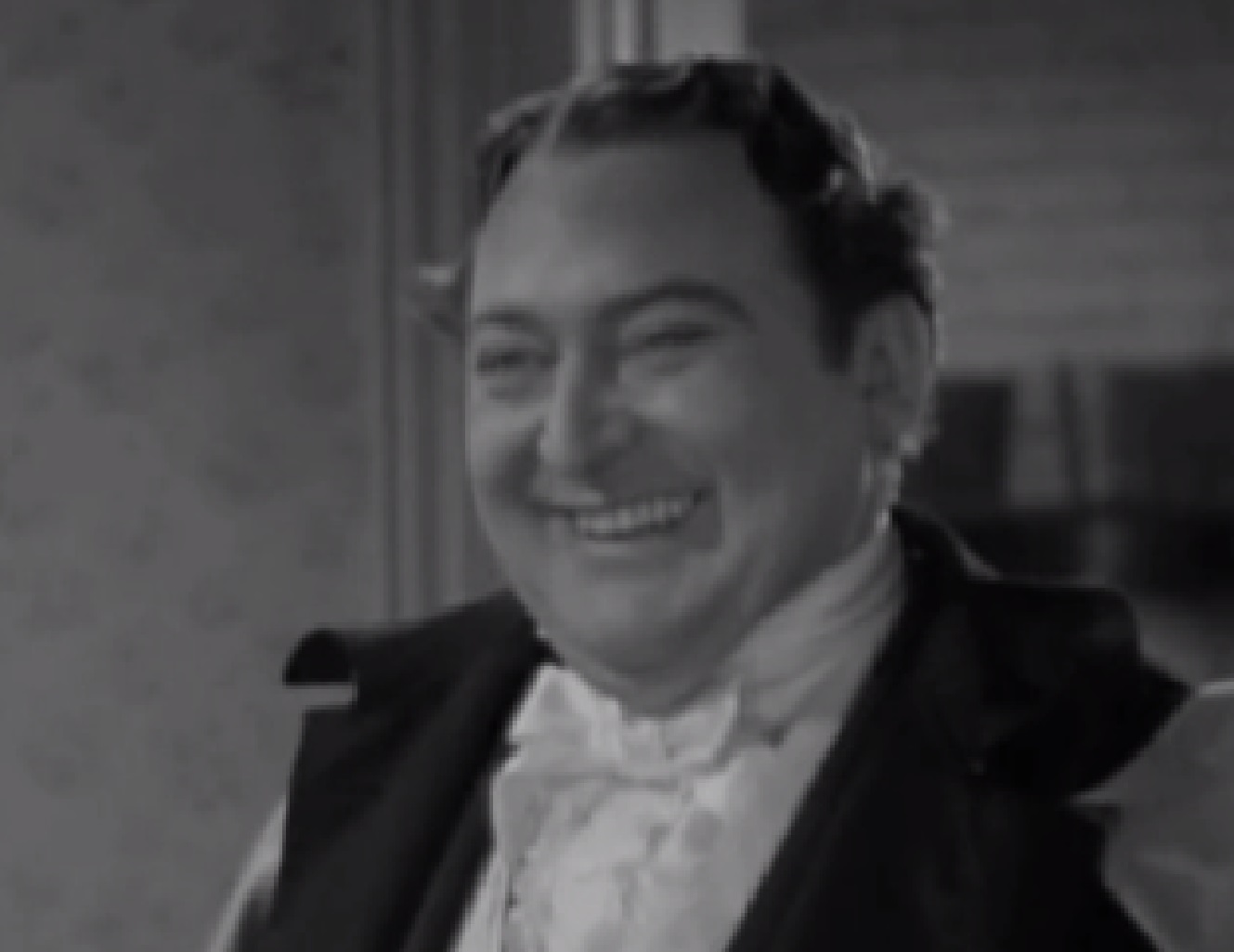 Screenshot of James Fisk (Edward Arnold)  laughing - from The Toast of New York (1937)