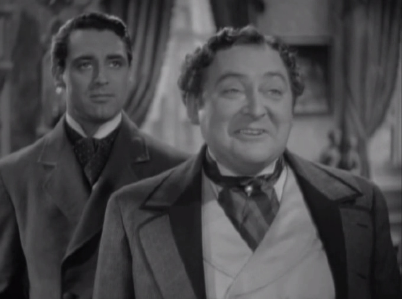 Screenshot of James Fisk (Edward Arnold) standing and laughing - from The Toast of New York (1937)