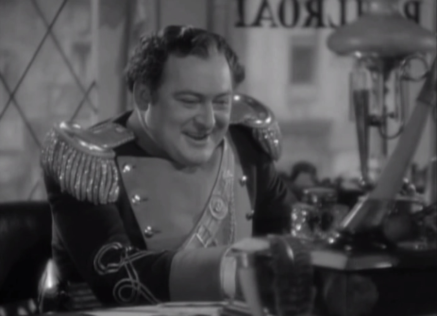 Screenshot of James Fisk (Edward Arnold) smiling and looking at front - from The Toast of New York (1937)