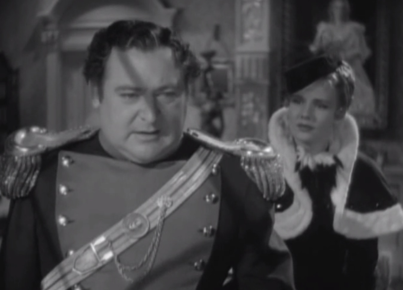 Screenshot of James Fisk (Edward Arnold) and Fleurique (Thelma Leeds) talking - from The Toast of New York (1937)