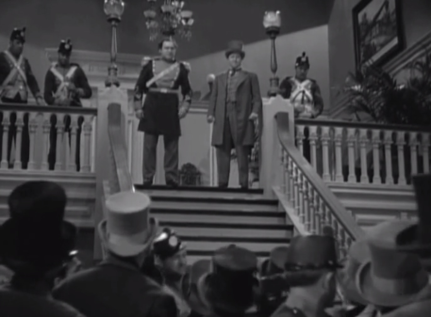 Screenshot of James Fisk (Edward Arnold) standing in front of a people - from The Toast of New York (1937)