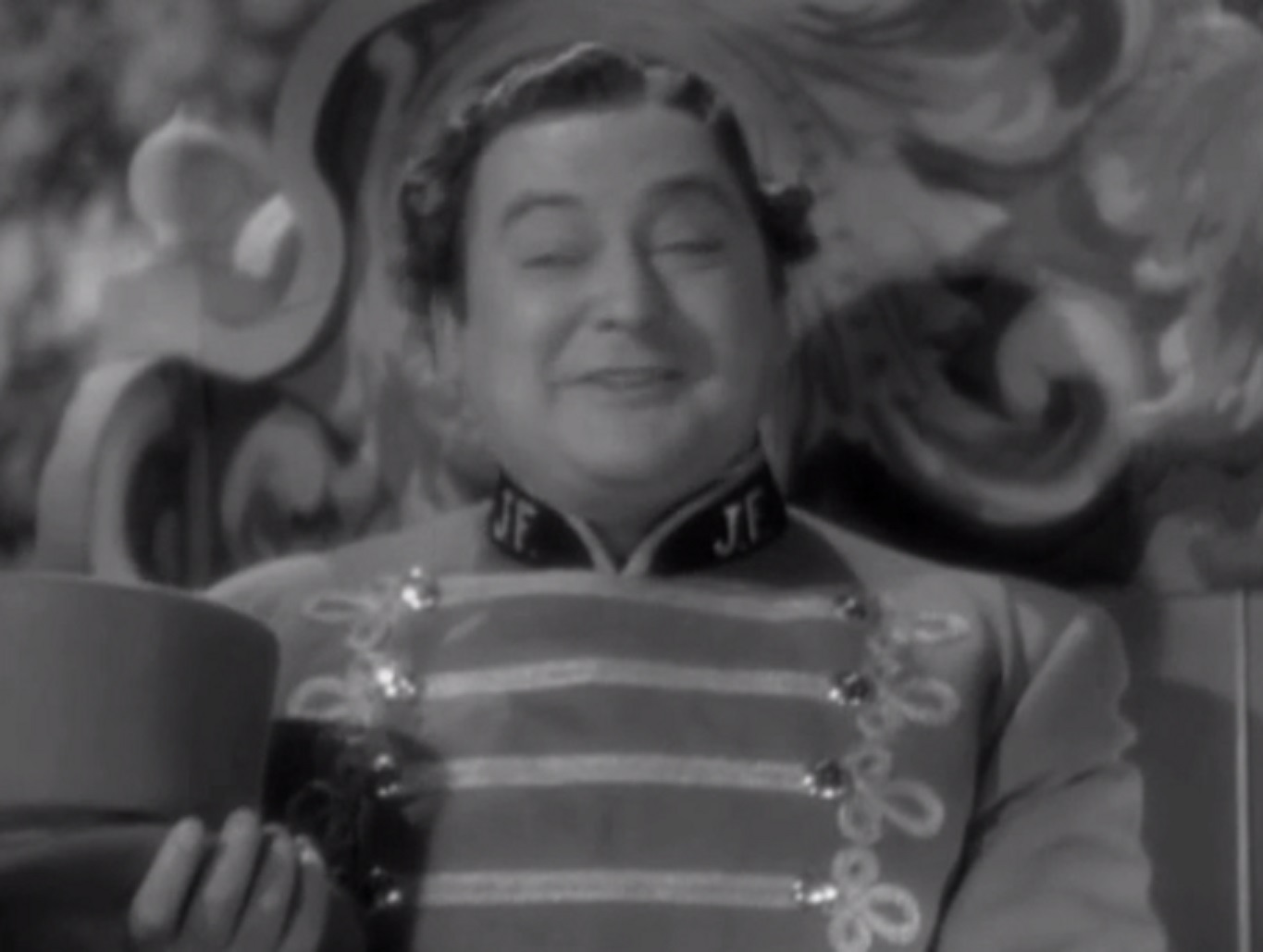 Screenshot of James Fisk (Edward Arnold) smiling at camera - from The Toast of New York (1937)